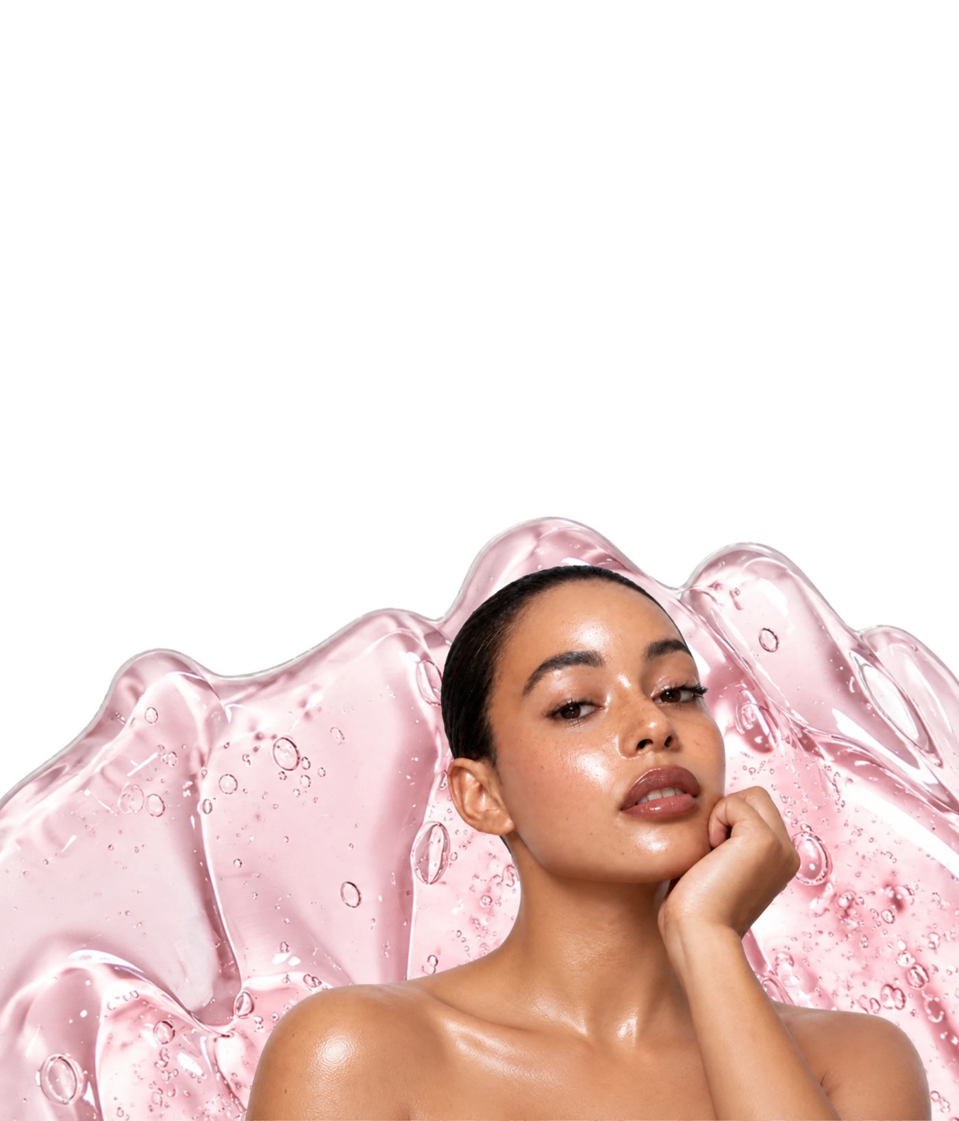 Model with glowing, hydrated skin against a pink gel texture